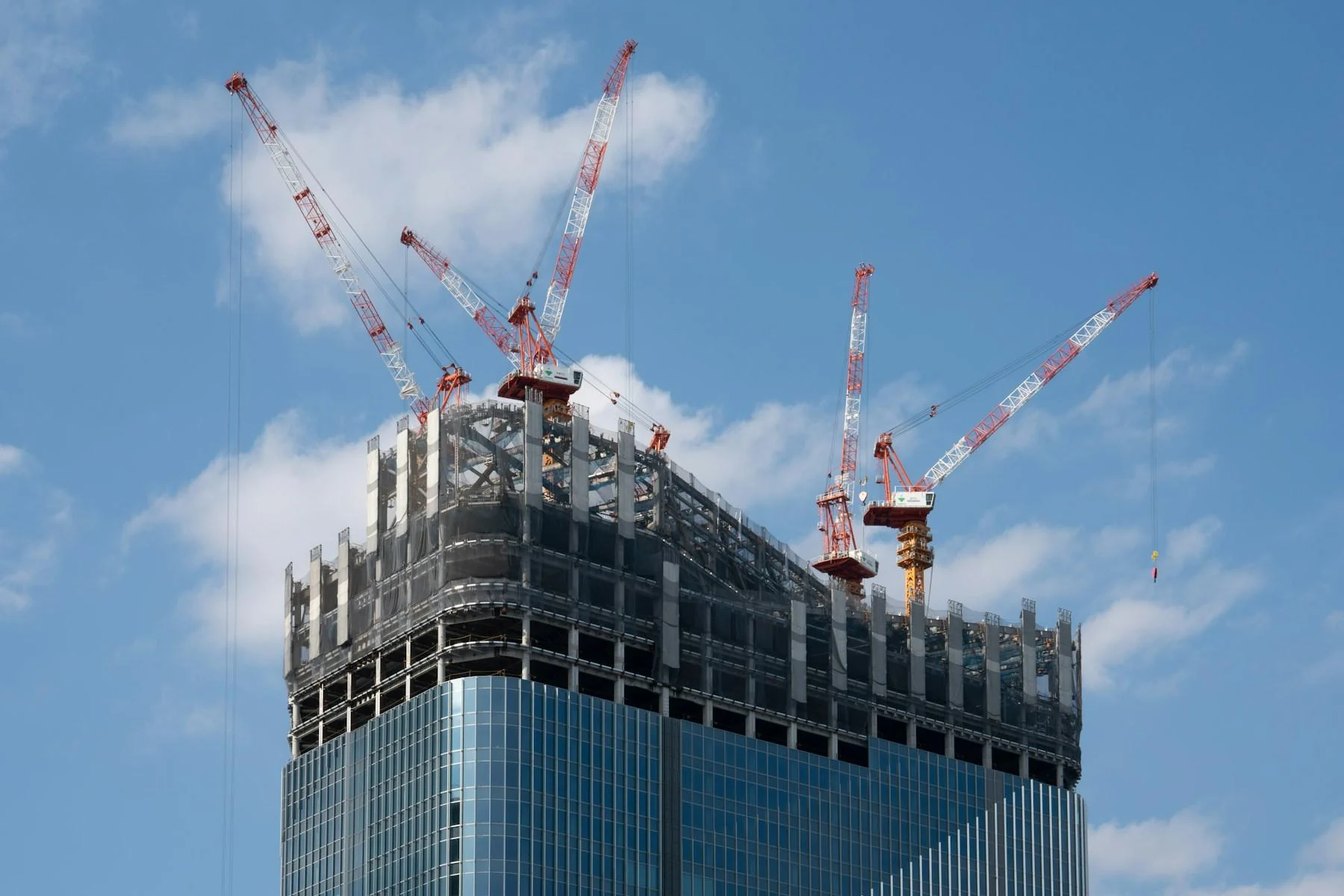 Structural construction and tower cranes at Takanawa Gateway, Tokyo, Japan